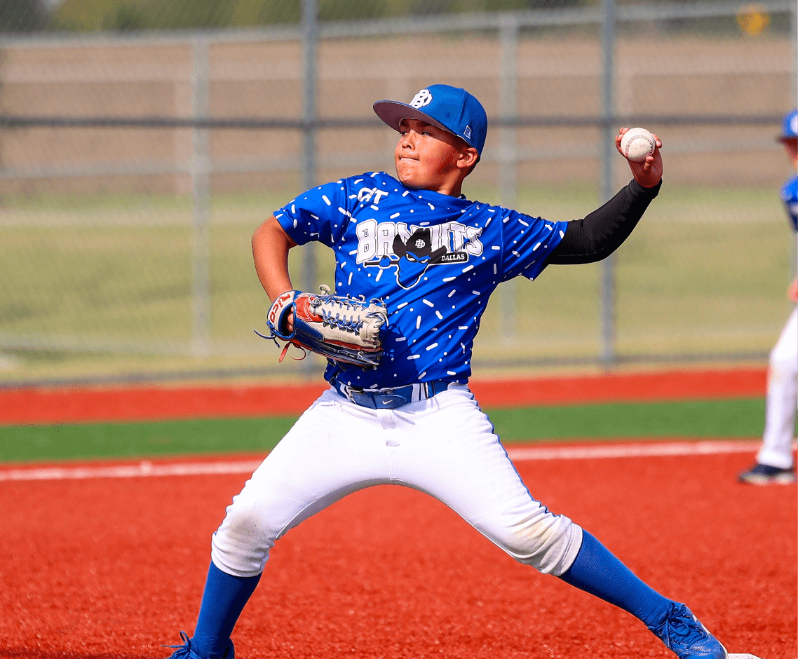 Boy in blue uniform pitching ball